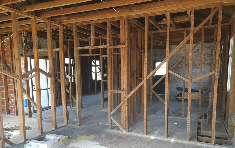 Exposed wooden framing in building interior