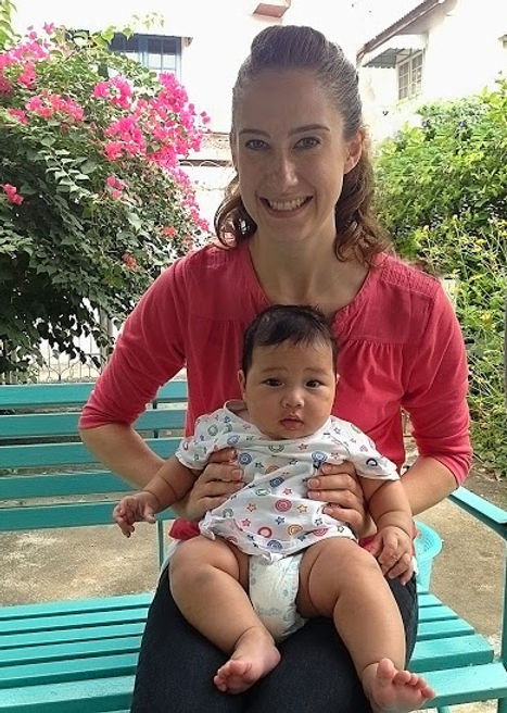 A mom holding her child