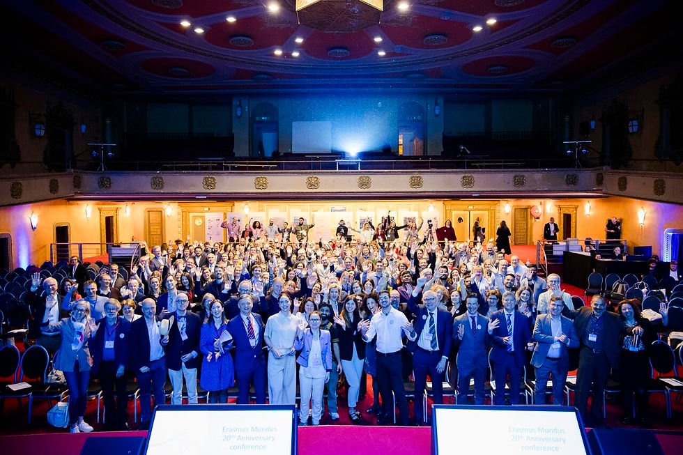 Participants of the Erasmus Mundus 20th Anniversary Conference pose together for a group shot in the conference's venue.