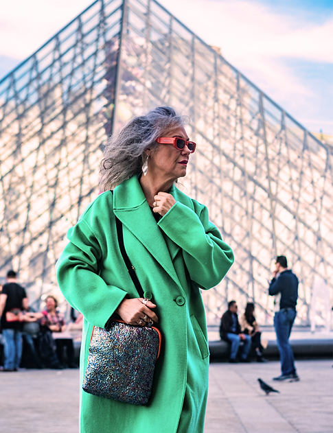 Older woman infront of Louvre