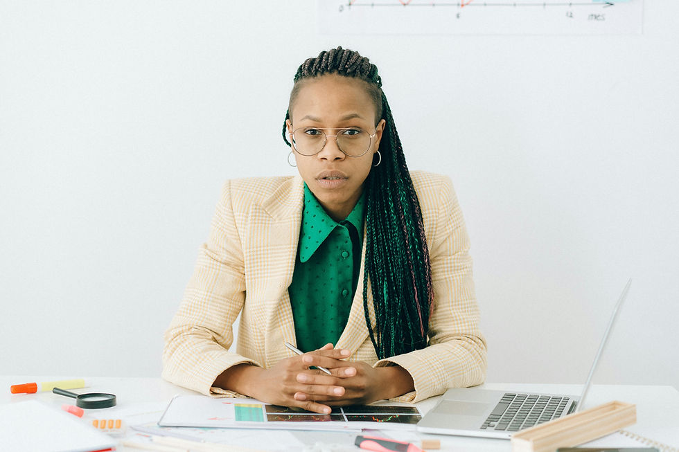 Black female entrepreneur sitting at desk