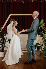 Wedding ceremony in front of the red velvet curtains at North Perth Town Hall