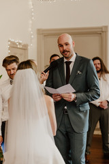 Wedding ceremony in front of the red velvet curtains at North Perth Town Hall