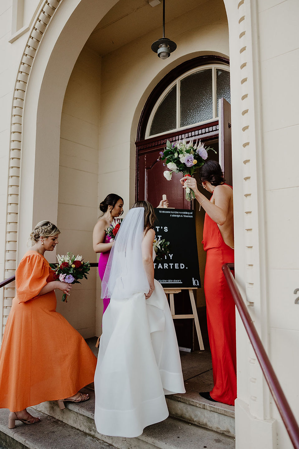 The wedding crew enter North Perth Town Hall for their wedding reception