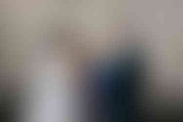 A child ringbearer hands over the wedding rings at the Secret Garden a Cottesloe Civic Centre