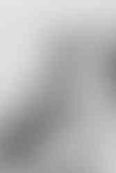 The brides mother smiling and hugging her daughter the bride