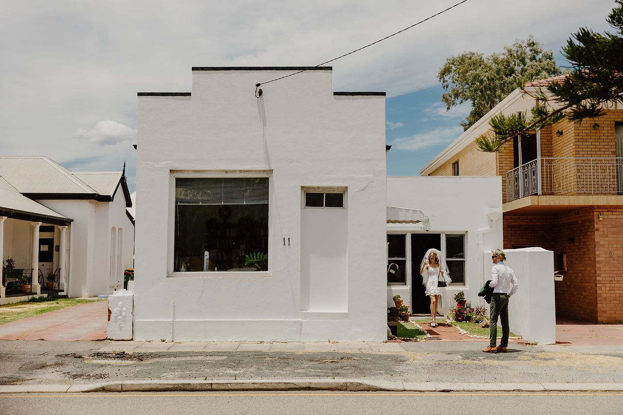 A bride and groom leaving their Fremantle home