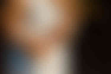 Two brides embrace as they look at the sunset at Anderson Point wedding venue in the Perth Hills.