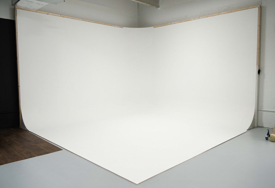 Large white cyclorama wall in the studio.