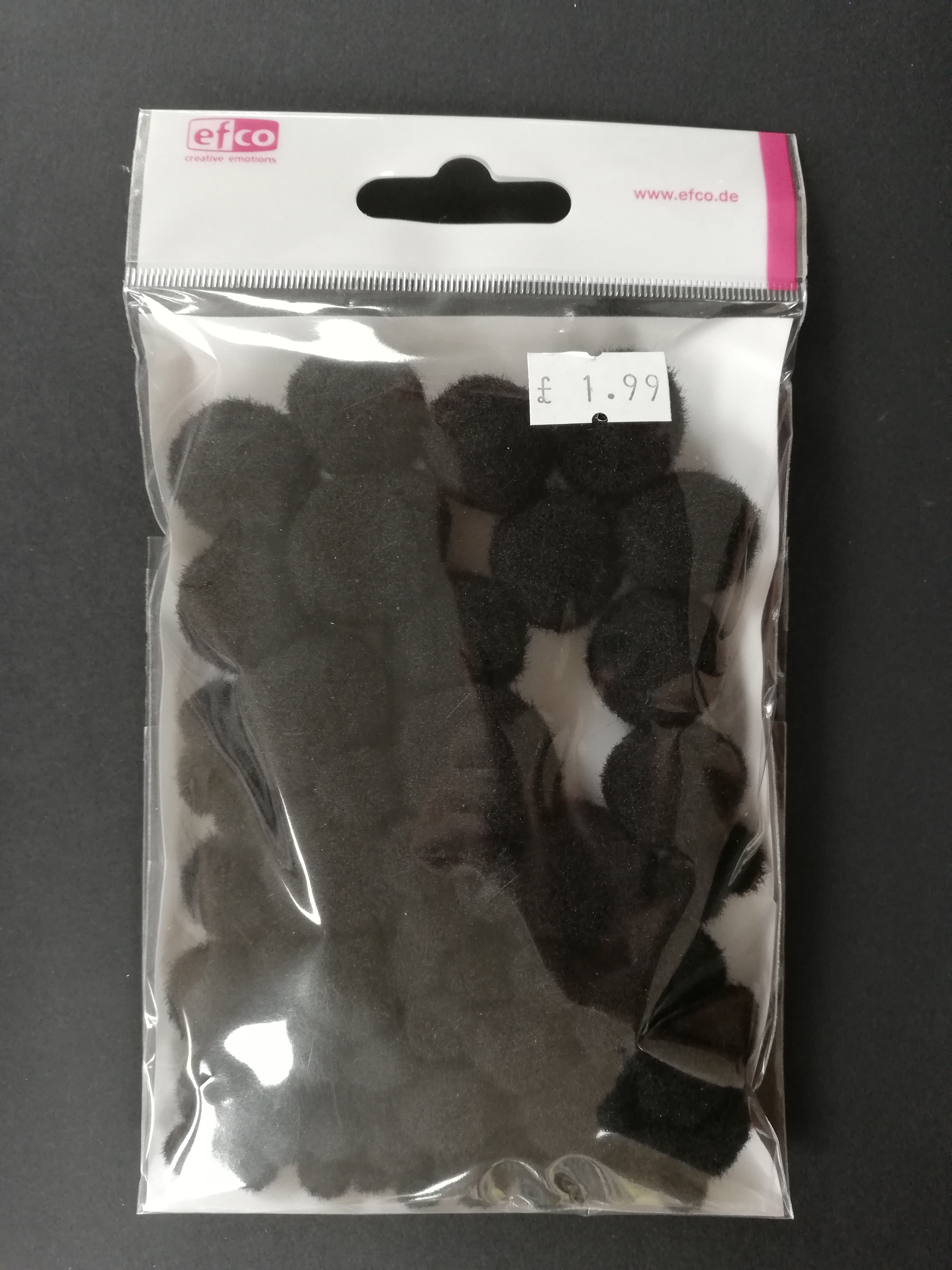 black pompoms, black pom poms