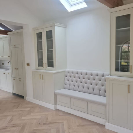 Bespoke banquette seating designed to create a practical dining area within the renovated open-plan living space in Bowdon.