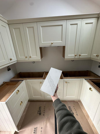 Granite worktop installation as part of the bespoke kitchen fitted by Stag Kitchens during the Bowdon garage conversion.