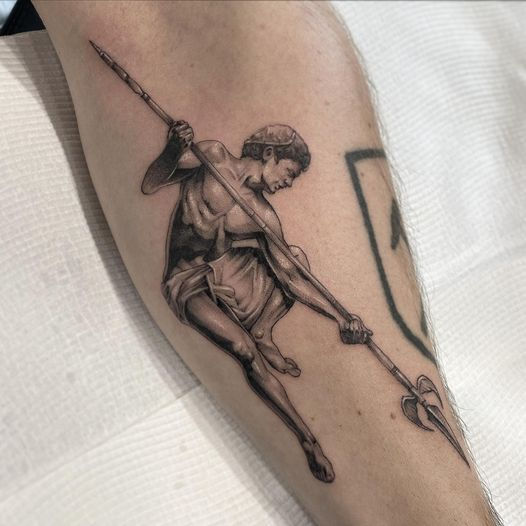 Spear man tattoo done by Punchy.tattoo