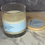 Thumbnail: Glass candle with "Lemon & Sage" label and wooden lid beside it.