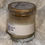 Thumbnail: Cinnamon, Honey, Vanilla candle with label on a fluffy white surface.