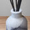 Thumbnail: White and grey ribbed vase with black reeds, minimal home decor.