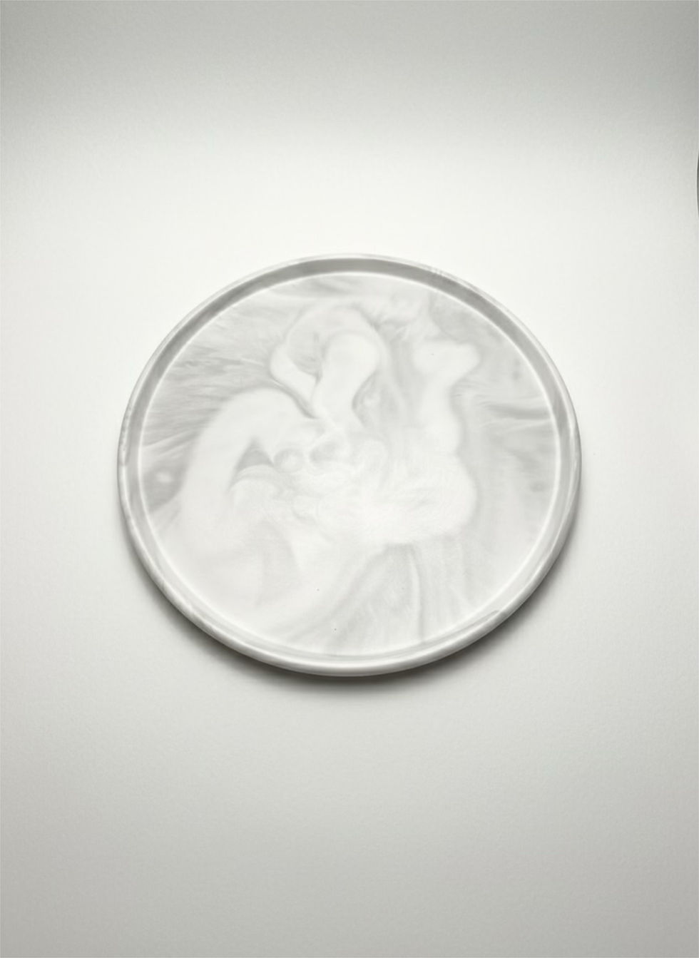 Marbled Round Tray - Large with a white and gray swirl pattern, on white surface