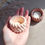 Thumbnail: Hand holding a small candle holder next to another; Natural Stone Dish.