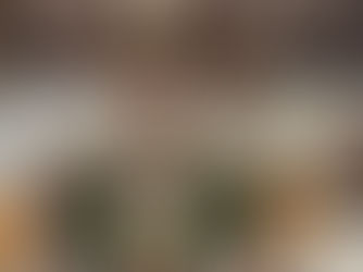 Shiva Lingam decorated with flowers, surrounded by lit lamps on a marble floor, creating a serene and spiritual atmosphere.Baidyanath Temple