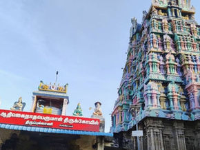 Colorful Hindu temple gopuram with Tamil signboard under blue sky, Tour Times logo at top left. Thirupullani Temple