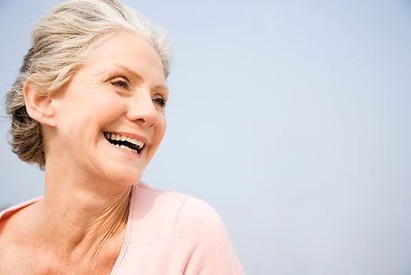 happy-mature-woman-smiling-in-natural-sunlight-2026-01-11-09-53-04-utc.jpg