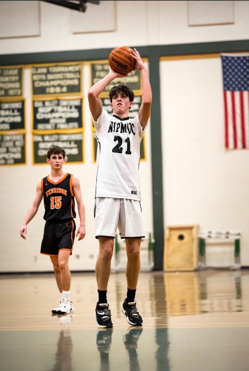 Nipmuc's James Mckinney is shooting two foul shots at home game against Uxbridge High during Tuesday's game at Npmuc's Gym in Upton.