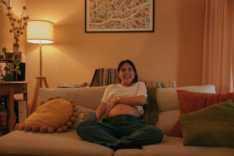 pregnant woman on her couch