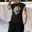 Thumbnail: Woman wearing a graphic tee featuring a yellow rose with splashes of color