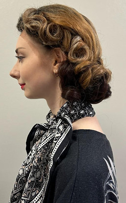 Finished styling or a short brown and black 1950's style wig