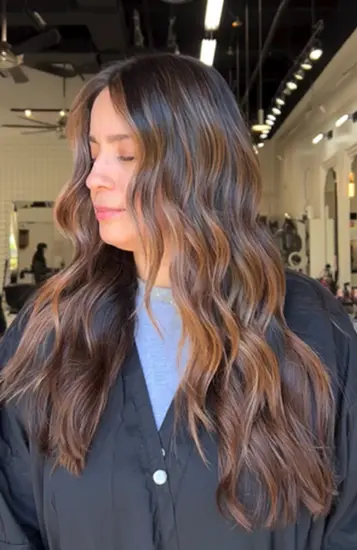 Brunette balayage long waves styled at Hello Beautiful Signature Salon