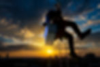 Silhouette  person window cleaner climbing hight risk building with safty equitment for cl