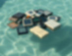 A Bunch of Broken Electronics in a pool of water.jpg