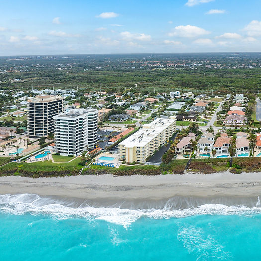 Juno Beach Florida residential community exterior with clean HOA-maintained buildings and landscaping