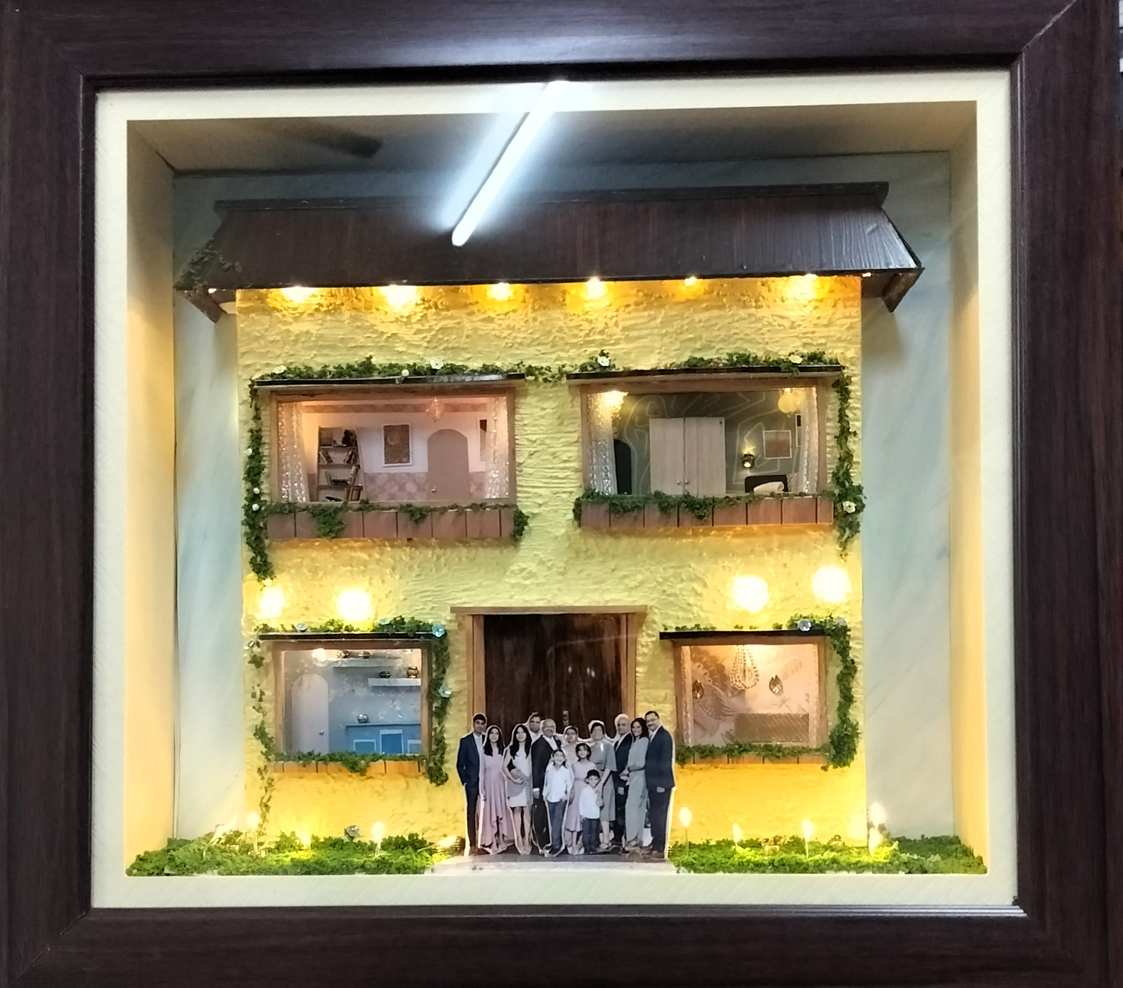 Illuminated Miniature House with Family Figurines - 12"(H) x 12"(L) x 3"(B)