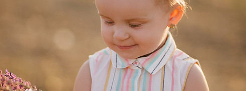 infant wearing a striped blouse