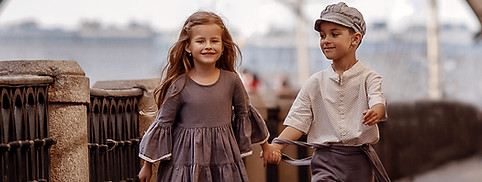 Boy and girl wearing woven clothing