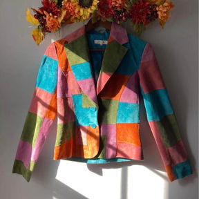 A vintage suede color-blocked blazer in orange, pink, green, and blue.