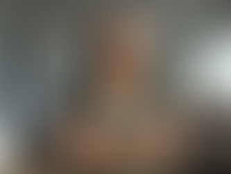 A woman in her mid-40s to early 50s standing confidently in a professional or modern home setting, subtle tension in posture softening into steadiness. Natural light. Minimalist aesthetic. Expression shows focus and intentional restraint — not serenity, but strength. Overlay Text: “Command Is Choice Under Pressure.”