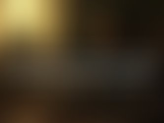 A cinematic photo of a woman sitting cross-legged near a window at golden hour, journal open, mug of coffee or tea beside her. The room glows in soft gold and sage tones, symbolizing peace returning to motion. Mood: grounded, calm, quietly powerful. Text: Pressure doesn’t mean you’re strong. It often means you’re unsupported.