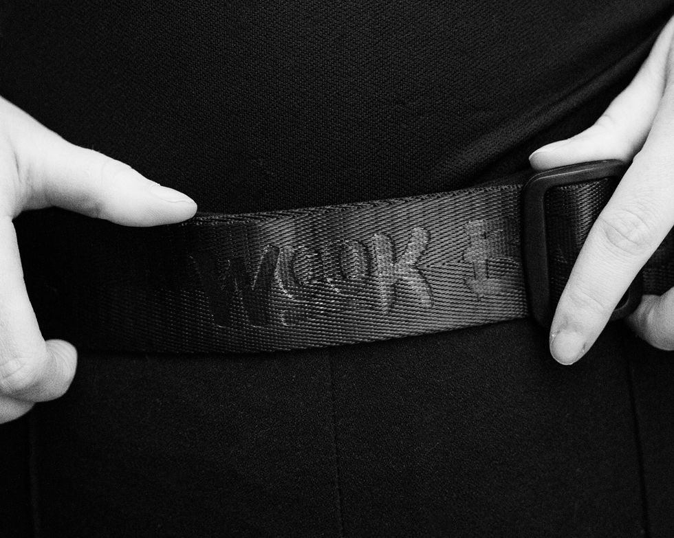 Close up of a all black strap that says wook bags