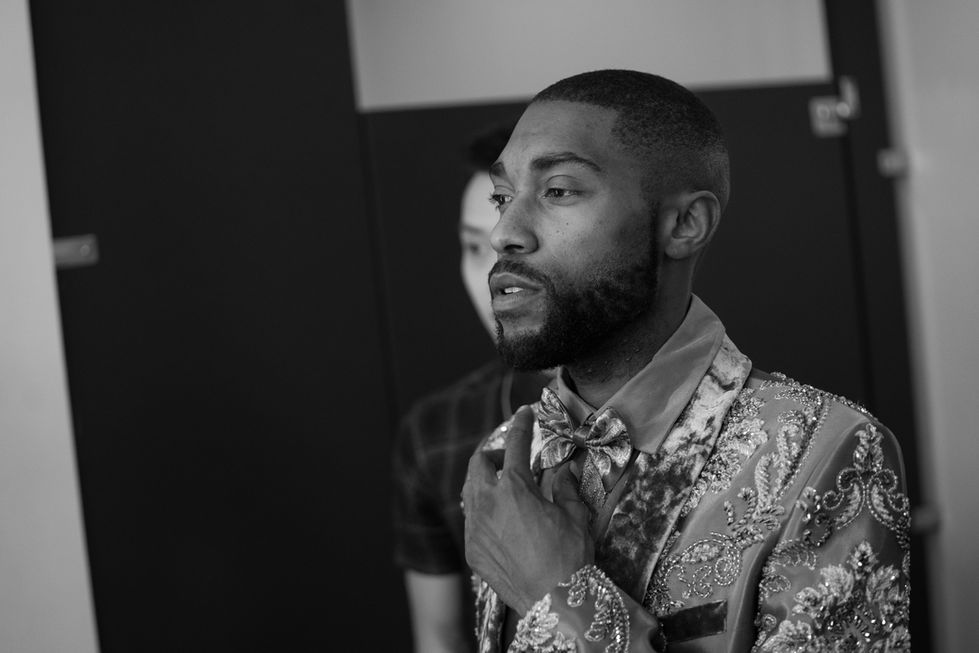 Youth Soul Love adjusting his bowtie backstage