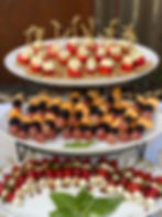 Skewered appetizer options: Classic caprese skewers, feta bites, and fruit skewers