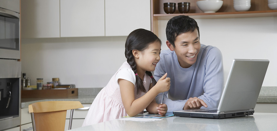 Father and daughter at computer