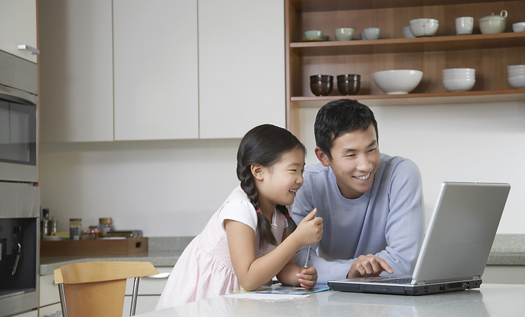 Father and daughter at computer