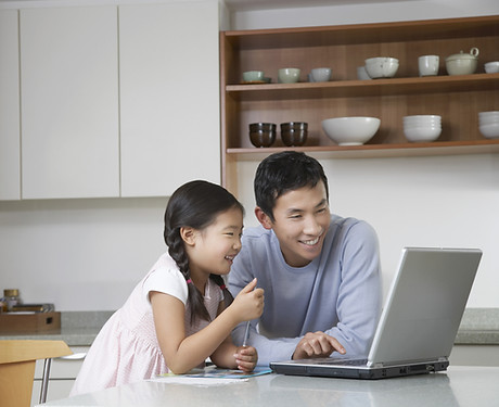 Father and daughter at computer