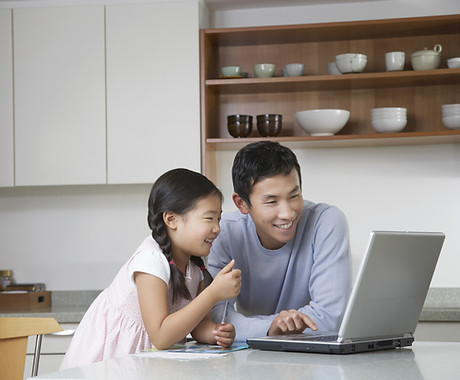 Father and daughter at computer