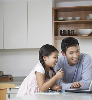 Father and daughter at computer