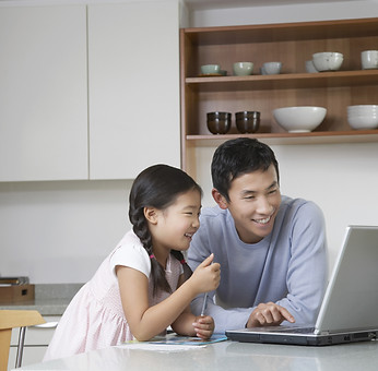 Father and daughter at computer