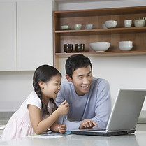 Father and daughter at computer
