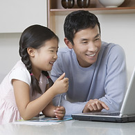 Father and daughter at computer